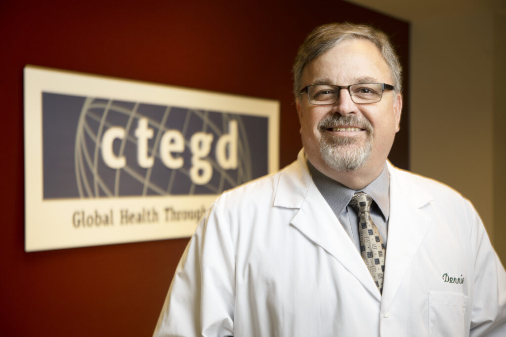 Dennis Kyle in the foreground. The CTEGD sign in the background